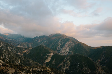 Pink cloudy sunset in the mountains of Angeles National Forest, California 