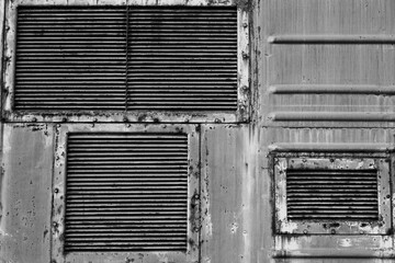 Ventilation grilles, old metal texture. The background of metal wall