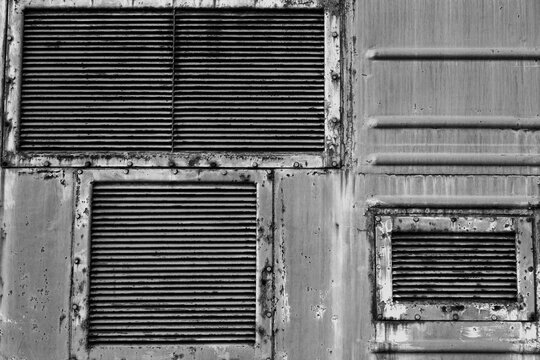 Ventilation grilles, old metal texture. The background of metal wall