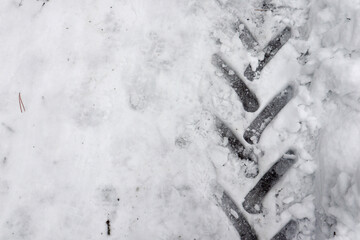 Fototapeta premium tractor tire track on snow macro