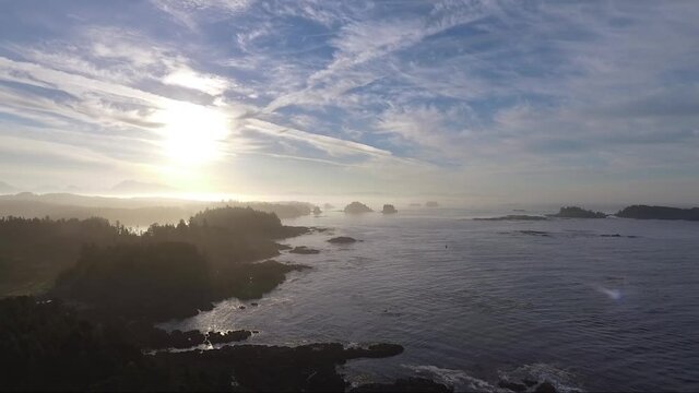 Aerial drone sunrise shot over the ocean in Ucluelet, British Columbia near Black Rock Resort.