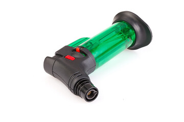 Clear green plastic gas lighter. Gas lighter isolated on white background. Close-up gas burner. Full depth of field.