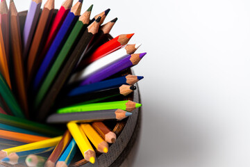 Drawing tools color pencils in glass beaker