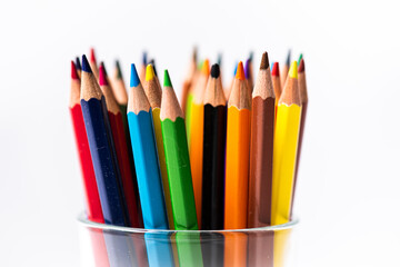 Drawing tools color pencils in glass beaker