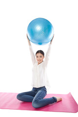 Portrait of a Young woman exercising with ball