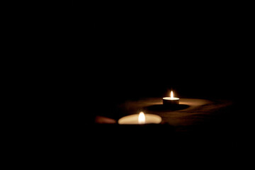 Burning candle on the table in honor of Memorial Day