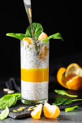 Mandarin, spinach and banana chia pudding with almond milk