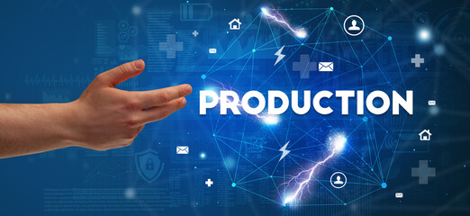 Hand pointing at PRODUCTION inscription, modern technology concept