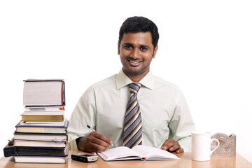 Indian business posing, isolated on a white background.