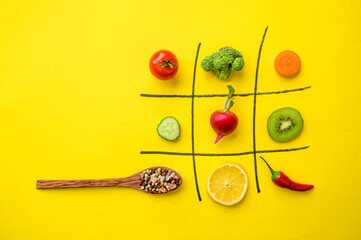 Vegan cross-zero game on yellow background
