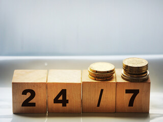 24 for 7 text on cubes on wooden background. clients Support Business concept
