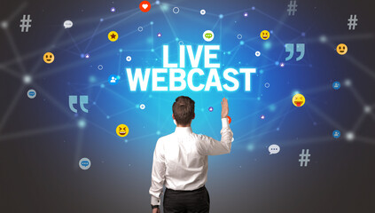 Rear view of a businessman with LIVE WEBCAST inscription, social networking concept
