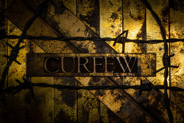 Curfew text on vintage textured monochrome silver grunge background