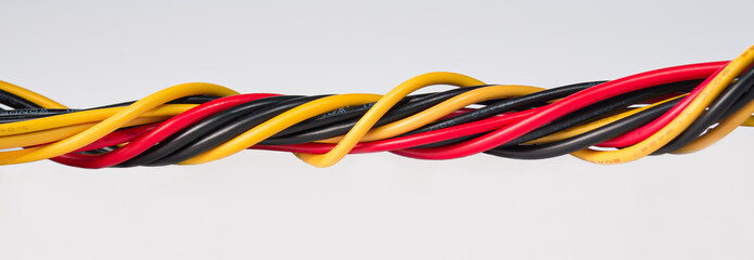 close-up of multicolored power computer wires on white background