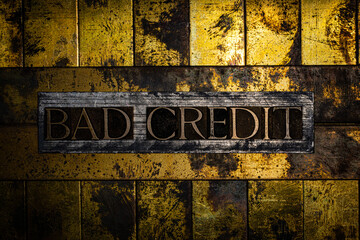 Bad Credit on vintage textured grunge copper and gold background