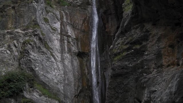 Mesmerizing beauty of towering waterfall in Ledro,Italy creates a unique atmosphere.