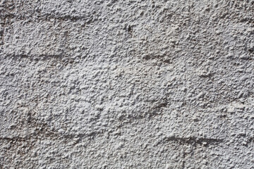 Uneven texture of white concrete brick wall