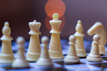 Plastic chess pieces in the foreground