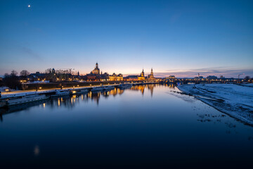 Fototapeta na wymiar Dresden Skyline in Winter, With Elbe River, Boats and Snow