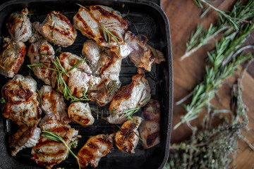 Frying pieces of beef in a pan