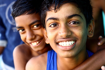 Happy teen boys looking at the camera.