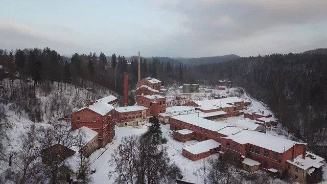 aerial view of an old red brick paper mill in Ligatne, Latvia. The factory is abandoned