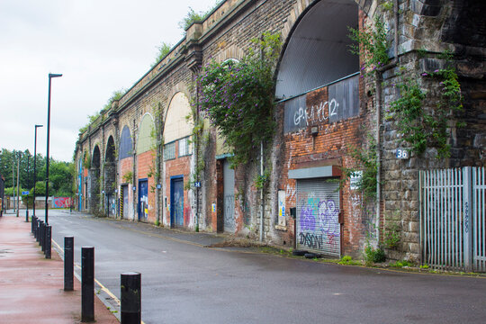 7 July 2020 Part of the Old Station Wall with a blocked up arch in Sheffield England now covered with graffiti. This railway bridge is preserved as a significant historic landmark