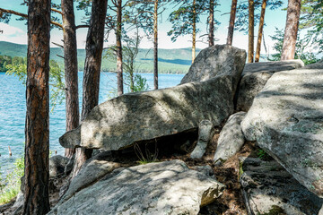 Stones on the island lake turgoyak in russia ural