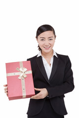 A young Business womman holding gift box