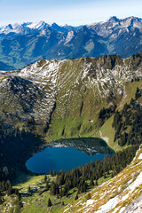 .A mountain lake with reflection of a mountain ridge.
