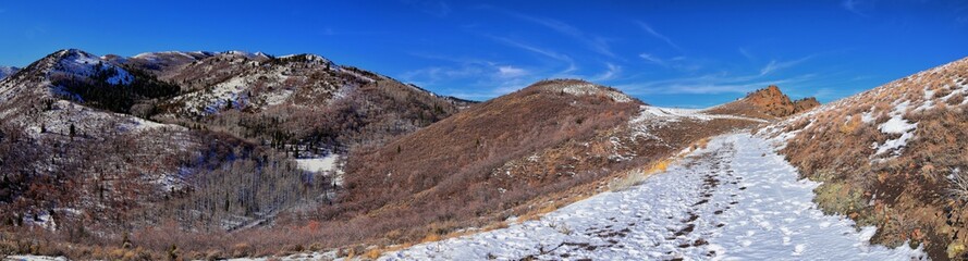 Winter Landscape panorama Oquirrh and Wasatch mountain views from Yellow Fork Canyon County Park Rose Canyon rim hiking trail by Rio Tinto Bingham Copper Mine, Utah. United States.