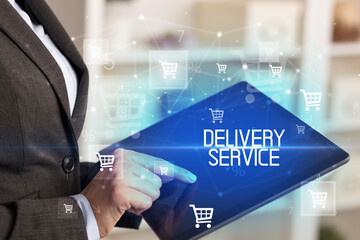 Young person makes a purchase through online shopping application with DELIVERY SERVICE inscription