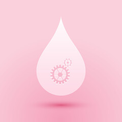 Paper cut Drop with gears icon isolated on pink background. Abstract concept for ecology theme, green eco energy, technology and industry. Paper art style. Vector.