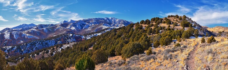 Winter Landscape panorama Oquirrh and Wasatch mountain views from Yellow Fork Canyon County Park Rose Canyon rim hiking trail by Rio Tinto Bingham Copper Mine, Utah. United States.