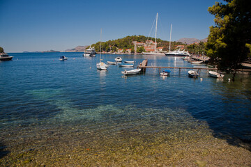 Fototapeta na wymiar Cavtat harbor and boats on crystal clear water