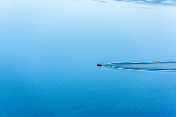 Leisure Boat on calm lake with copy space