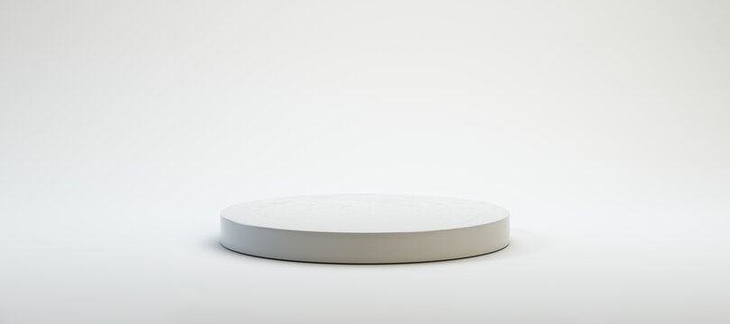 circular white pedestal in front of white background