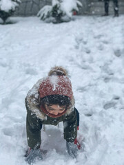 child playing with snow