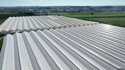 Greenhouses in field. Aerial view.