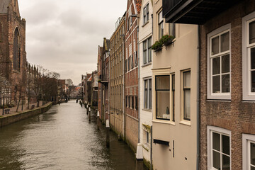 Fototapeta na wymiar canal lined with houses in the medieval town centre of Dordrecht, the Netherlands