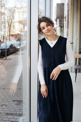 Young elegant girl posing indoor. Pretty beautiful business woman in elegant dress