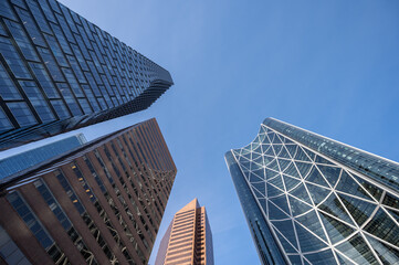 Fototapeta na wymiar Looking up at a tall skyscraper in Calgary, Alberta