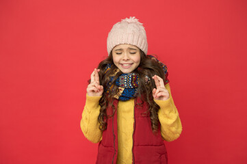 teen child in puffer waistcoat and knitwear make wish. seasonal kid fashion. christmas holiday and...