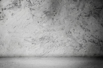 empty room with plaster wall, grey background. Old plastered wall in an empty room. Background for montage and advertising of your products.