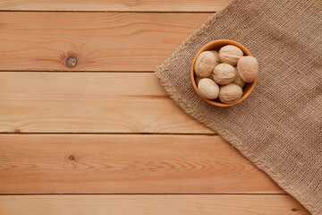 Tasty wallnuts mix on a wooden table.