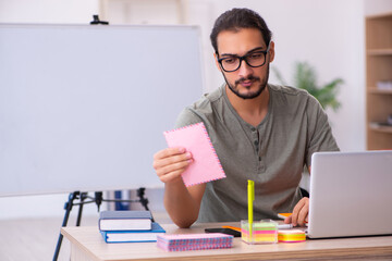 Young male designer working in the office