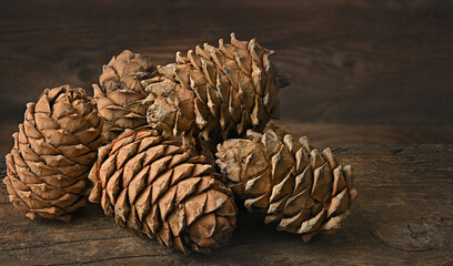 pine nuts stacked in a pile lie on an old wooden board side view