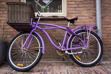 Fototapeta na wymiar Typical style of colorful bicycle with basket in Holland， Netherlands