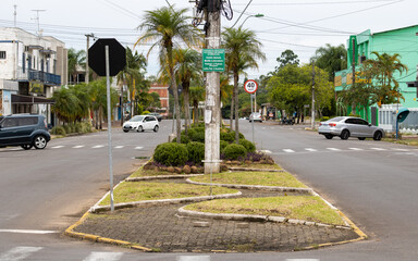 Fototapeta na wymiar Portão, Rio Grande do Sul, Brazil, January 2021. View of Avenida Brasília located in the city center of Portão. It has a central construction site and is a duplicated avenue.