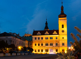 Naklejka na ściany i meble Scenic night view of illuminated building of Old Town Hall on central square of Mlada Boleslav, Czech Republic